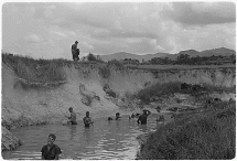 U.S. Marines Bathe in a Stream