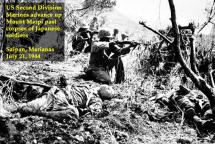 Marines Advance Past Dead Japanese Soldiers